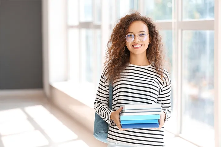 Image of a woman holding small boxes